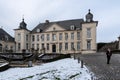 Jodoigne, Wallonia - Belgium - Classical town hall and park in the snow