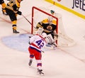 Joel Ward puts a shot on Tim Thomas (NHL Hockey) Royalty Free Stock Photo