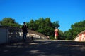Jogger and Dog walker on the Weeks Memorial Bridge, Cambridge Royalty Free Stock Photo