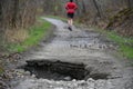 jogger rerouting due to a sinkhole on a running trail Royalty Free Stock Photo