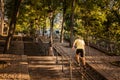 Jogger running up the steps of Montmartre Hill on a beautiful sunny morning in Paris, France