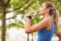 Jogger woman drinking water in park Royalty Free Stock Photo