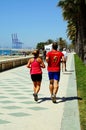 Joggers along promenade, Malaga.