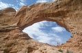 Joggers inside arch at Arches Natiional Park, UT