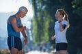 Jogging couple planning running route and setting music