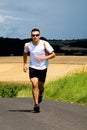 Jogging through the fields Royalty Free Stock Photo