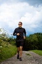 Jogging through the fields Royalty Free Stock Photo