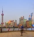 Jogging man, illuminated Shanghai cityscape