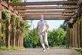 A man in sporstwear jogging in the park