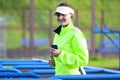 Smiling Positive Professional Female Runner During Outdoor Training.