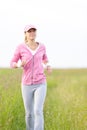 Jogging sportive young woman running park field Royalty Free Stock Photo