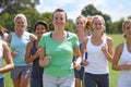 Jogging their way towards better health. A group of young women running on a sportsfield together. Royalty Free Stock Photo