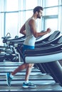 Jogging on treadmill. Royalty Free Stock Photo