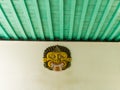 JOGJA, INDONESIA - AUGUST 12, 2O17: Close up view of a indonesian mask hanging in a white wall in Taman Sari water