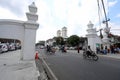 Motorbikes and rickshaws pass through a gateway leading into the SultanÃ¢â¬â¢s Palace complex