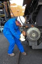 Female Technician checking equipment at Coal Burning Power Station