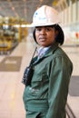 Female Technician in turbine room at Coal Burning Power Station