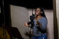 Judith Sephuma, South African singer recording vocal part on Afro-pop song in studio