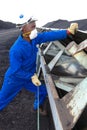 Technician checking conveyor belt at Coal Burning Power Station