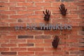 wall made of brick inside the famous Apartheid Museum in Johannesburg with the slogan \