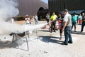 Fire hazard training with a powder-based extinguisher