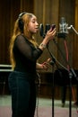 African Artist Victoria Kimani, Kenya singing in a SABC recording studio