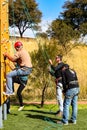 African person having fun on a outdoor climbing wall