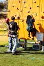 African person having fun on a outdoor climbing wall