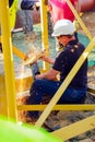 Tradesman working with an angle grinder on a building site Royalty Free Stock Photo