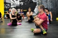 Personal Trainer giving fitness instruction at a Crossfit group class