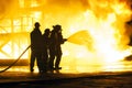 JOHANNESBURG, SOUTH AFRICA - MAY, 2018 Firefighters spraying water at fire during a firefighting training exercise