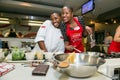 Diverse young people learning to cook and bake at a cooking class Royalty Free Stock Photo