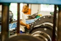 Diverse workers inside a rubber and pipe fabrication assembly line in a factory