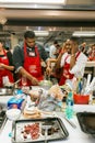 Diverse young people learning to cook and bake at a cooking class Royalty Free Stock Photo