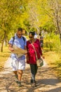 Young couple walking on a path with a map at The Winter Sculpture Fair at Nirox Sculpture Park