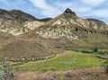 The John Day River flows below Sheep Rock at the John Day Fossil Beds National Monument in Oregon, USA Royalty Free Stock Photo