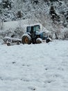 John deer tractor covered in snow Royalty Free Stock Photo