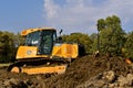 John Deere bulldozer pushes earth