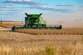 A John Deere Combine harvester clearing a soybean field Royalty Free Stock Photo