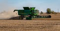 A John Deere combine harvesting