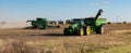 A John Deere combine harvesting soybean Royalty Free Stock Photo