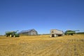 JOHN DEERE COMBINES IN HARVEST FIELD Royalty Free Stock Photo