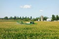 A john deere crop sprayer spreading insecticide at a farm in ontario Royalty Free Stock Photo