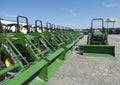 John Deere Dealership lineup of tractors with buckets Royalty Free Stock Photo