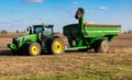 A John Deere farm tractor parked in a soybean field Royalty Free Stock Photo