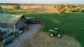 John Deere Green Tractor outside of a barn on a farm Royalty Free Stock Photo