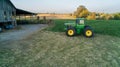 John Deere Green Tractor outside of a barn on a farm Royalty Free Stock Photo