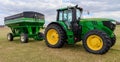John Deere 6145M with Brent Auger Wagon Royalty Free Stock Photo