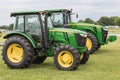 John Deere Models 5100E and 8335R Tractors