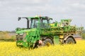 John Deere R4040i sprayer spraying in RSO field Royalty Free Stock Photo